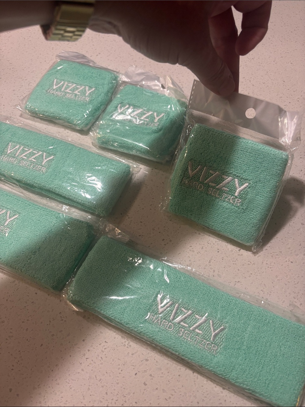 Vizzy Hard Seltzer Branded Aqua Headband and Wristbands Set three of each